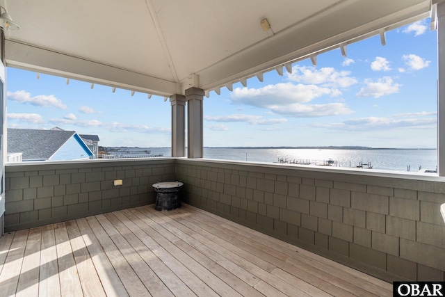 wooden terrace with a water view