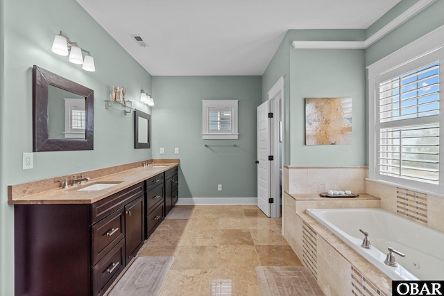 2916 Bay Drive Lots 17&18, Kill Devil Hills, NC 27948 - full bath with a garden tub, a sink, visible vents, baseboards, and double vanity