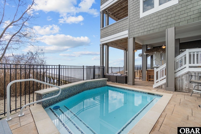 view of swimming pool featuring stairs, outdoor lounge area, a fenced in pool, and a patio