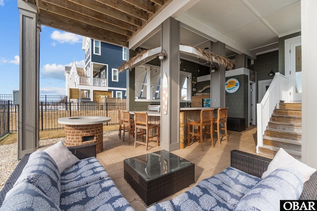 view of patio / terrace with fence, outdoor dry bar, and an outdoor hangout area