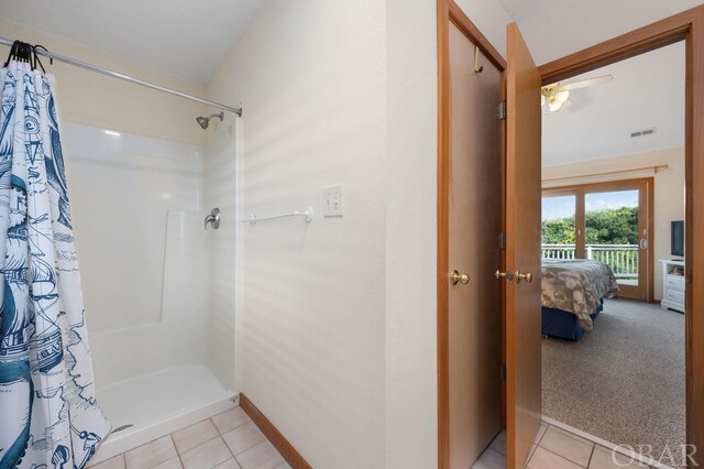 ensuite bathroom with ensuite bathroom, a shower stall, visible vents, and tile patterned floors