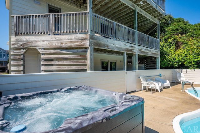 exterior space featuring a hot tub