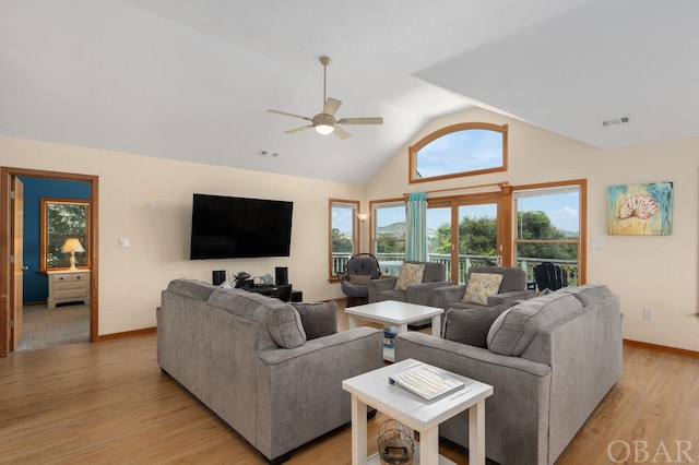 living area with a ceiling fan, light wood-type flooring, visible vents, and baseboards