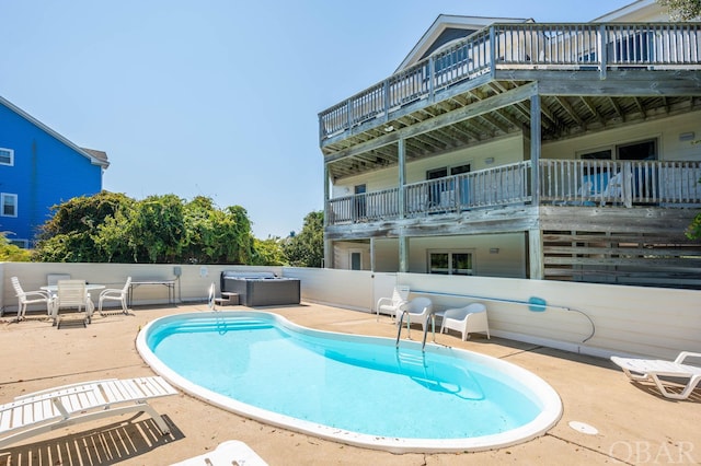 pool featuring a patio area and fence