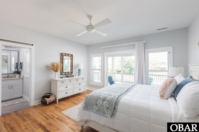 123 Skimmer Way Lot 48, Duck, NC 27949 - bedroom featuring light wood-style flooring, ensuite bath, access to outside, and baseboards