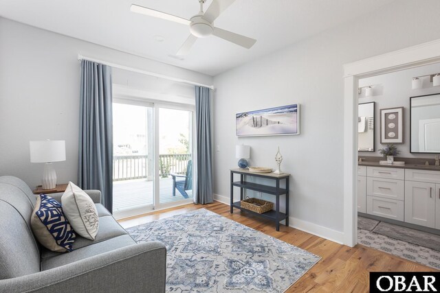 123 Skimmer Way Lot 48, Duck, NC 27949 - living room with ceiling fan, light wood finished floors, and baseboards
