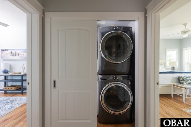 123 Skimmer Way Lot 48, Duck, NC 27949 - laundry room featuring stacked washer / dryer, wood finished floors, and ceiling fan