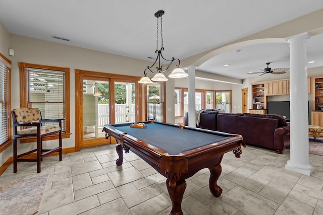 rec room with arched walkways, ornate columns, visible vents, ceiling fan, and baseboards