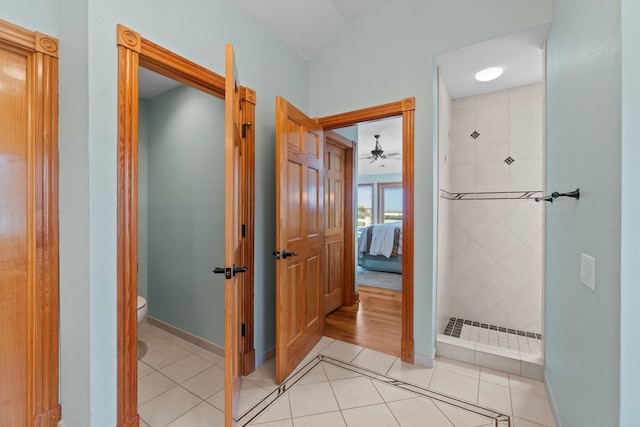 ensuite bathroom with toilet, ensuite bath, a tile shower, and tile patterned floors