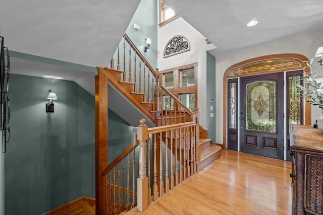 entrance foyer with light wood finished floors and stairs