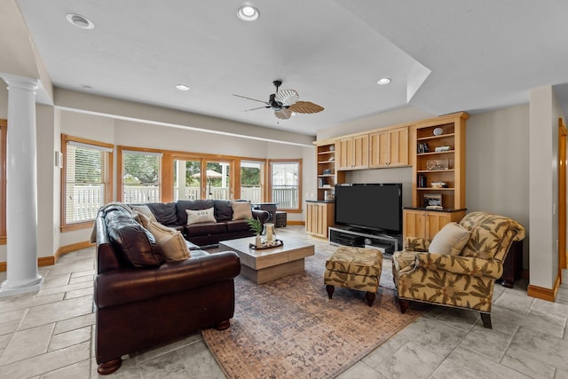 living room featuring a ceiling fan, recessed lighting, decorative columns, and baseboards