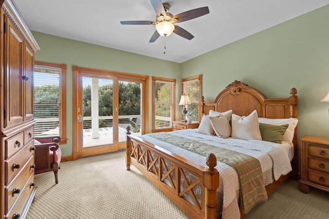 bedroom featuring access to exterior, ceiling fan, and light colored carpet