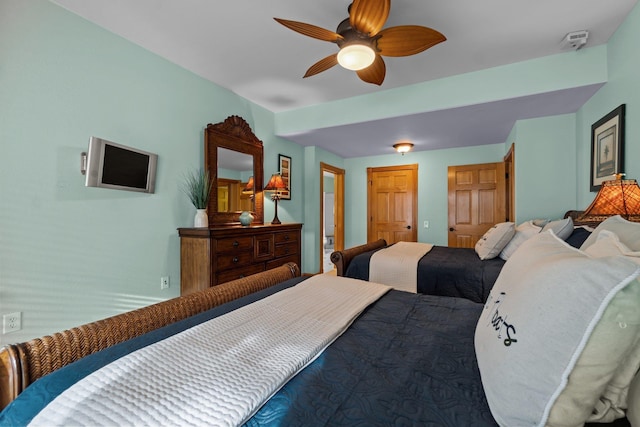 bedroom featuring ceiling fan and a closet