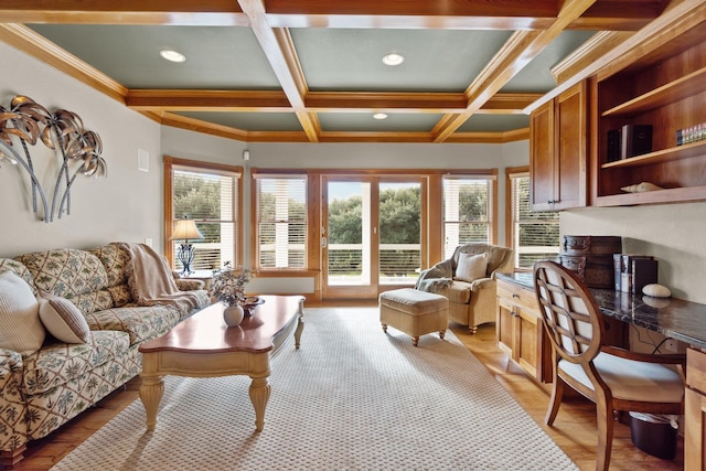 living area with beamed ceiling, coffered ceiling, and crown molding