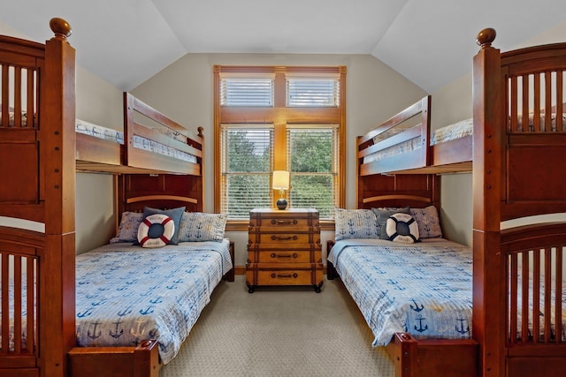 bedroom with lofted ceiling and light carpet