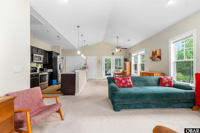 715 Arvilla Ln Lot 4, Manteo, NC 27954 - living area featuring french doors, light colored carpet, vaulted ceiling, a ceiling fan, and recessed lighting