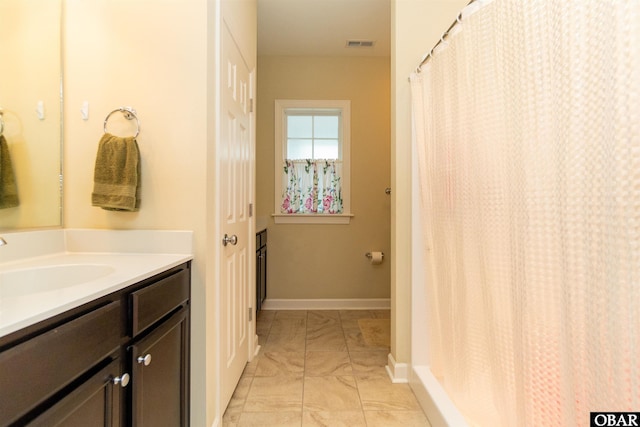 715 Arvilla Ln Lot 4, Manteo, NC 27954 - bathroom with vanity and marble finish flooring