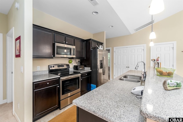 715 Arvilla Ln Lot 4, Manteo, NC 27954 - kitchen with stainless steel appliances, hanging light fixtures, light stone countertops, recessed lighting, and light tile patterned floors