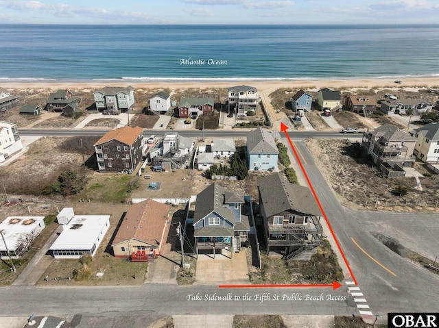 birds eye view of property with a residential view and a view of the beach