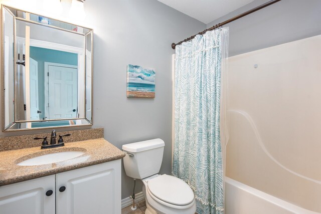 full bath featuring shower / tub combo, toilet, and vanity