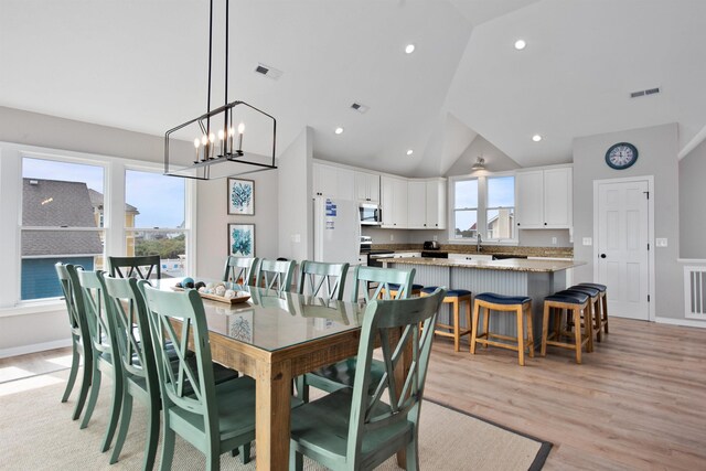 dining room featuring recessed lighting, visible vents, and light wood finished floors