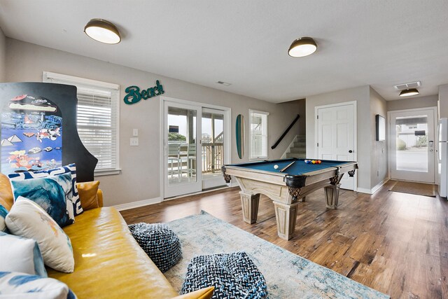 game room with visible vents, pool table, baseboards, and wood finished floors