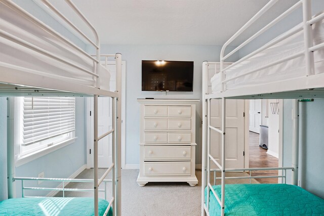 unfurnished bedroom featuring baseboards and carpet floors