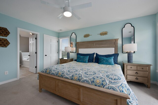 carpeted bedroom featuring visible vents, a ceiling fan, baseboards, and connected bathroom