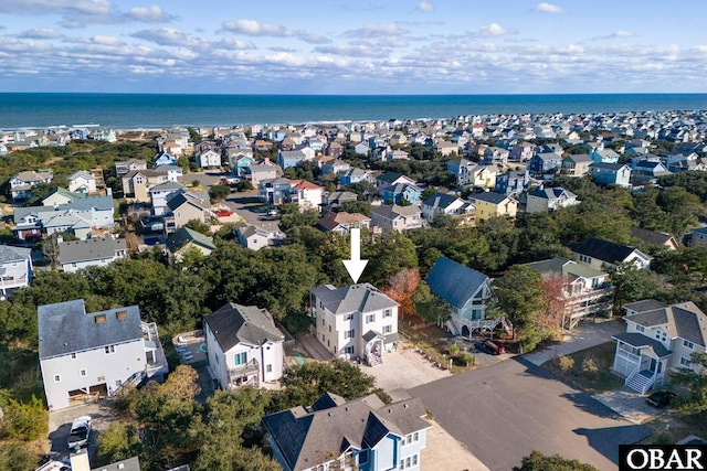 birds eye view of property featuring a water view and a residential view