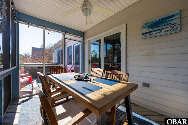 sunroom featuring ceiling fan