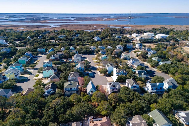 bird's eye view featuring a water view and a residential view