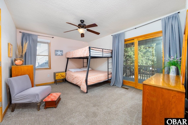 bedroom with carpet floors, a ceiling fan, a textured ceiling, access to outside, and baseboards