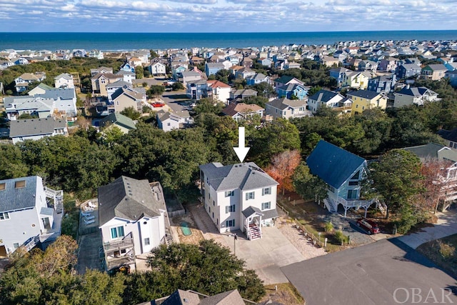 aerial view featuring a water view and a residential view