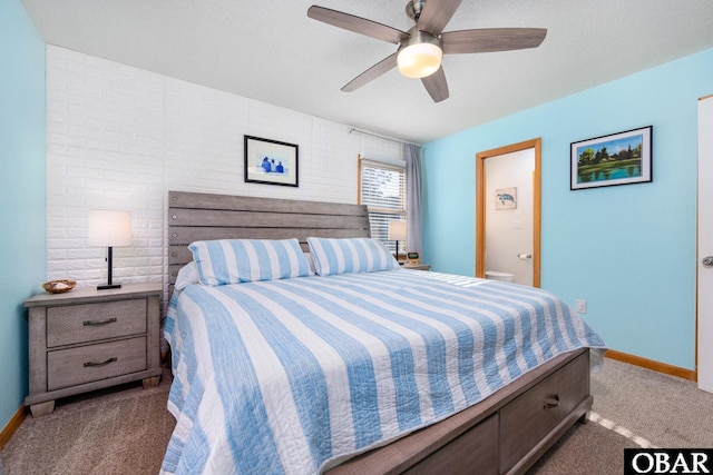 carpeted bedroom featuring a ceiling fan and baseboards