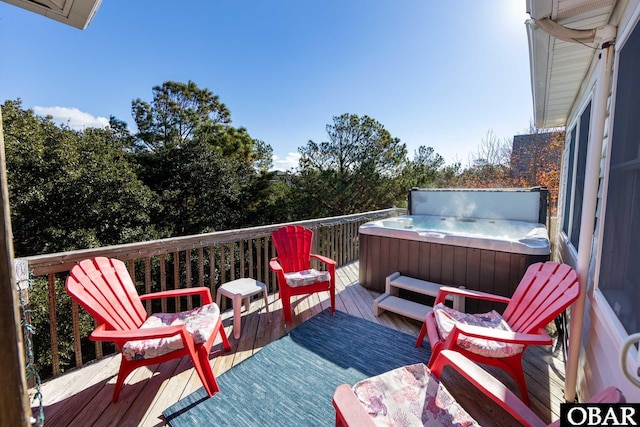 wooden deck featuring a hot tub