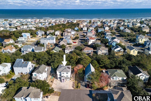 drone / aerial view featuring a water view and a residential view