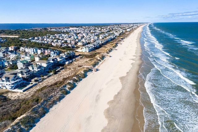 birds eye view of property with a water view, a residential view, and a view of the beach