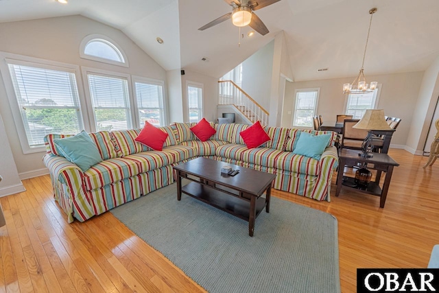 108 E Fresh Pond Dr Lot 24, Kill Devil Hills, NC 27948 - living area with a chandelier, vaulted ceiling, light wood finished floors, ceiling fan, and stairs
