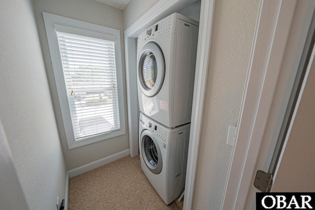 108 E Fresh Pond Dr Lot 24, Kill Devil Hills, NC 27948 - washroom featuring stacked washer / dryer and light carpet