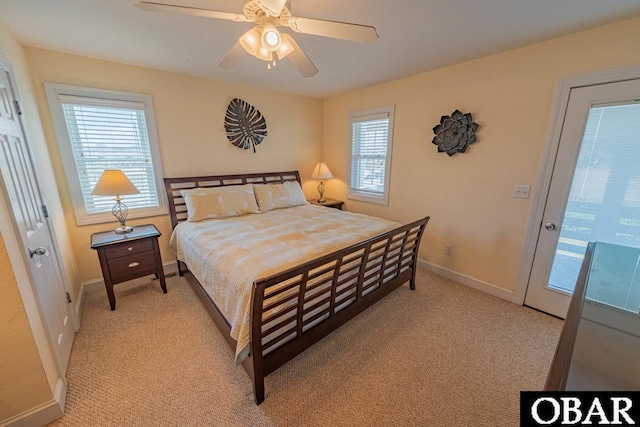 108 E Fresh Pond Dr Lot 24, Kill Devil Hills, NC 27948 - bedroom featuring multiple windows, light carpet, and ceiling fan