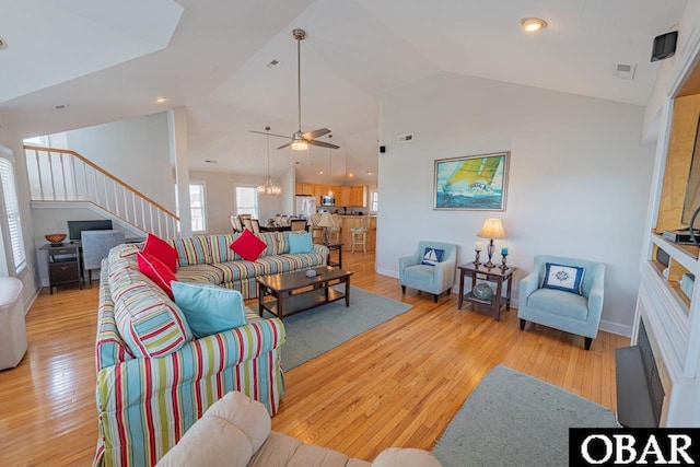 108 E Fresh Pond Dr Lot 24, Kill Devil Hills, NC 27948 - living area with stairs, lofted ceiling, light wood-type flooring, and a ceiling fan