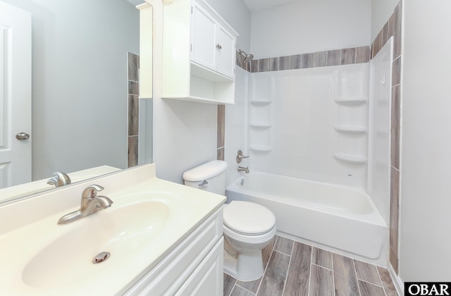 full bath with shower / bathing tub combination, vanity, toilet, and wood tiled floor