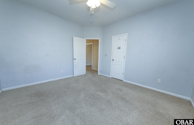 unfurnished room with light carpet, ceiling fan, and baseboards