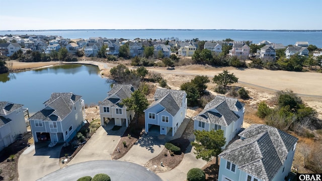 aerial view with a water view and a residential view