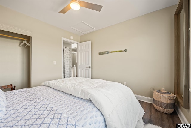 bedroom featuring attic access, baseboards, ceiling fan, dark wood-style flooring, and a closet