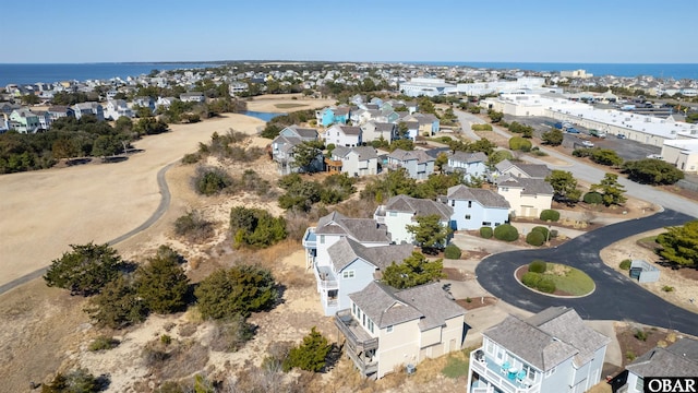 bird's eye view featuring a residential view and a water view