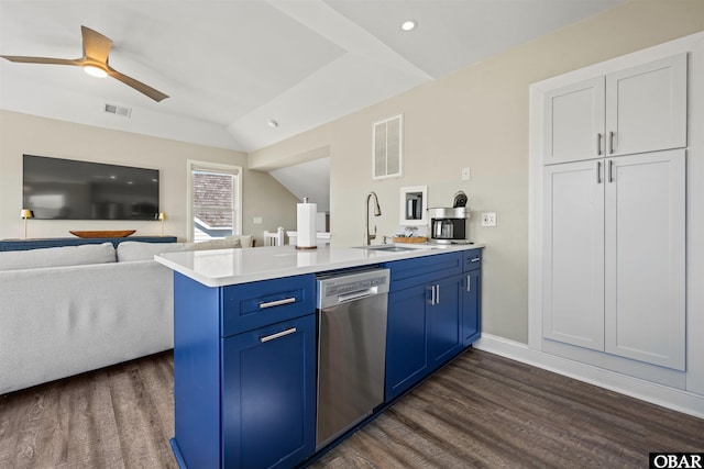 kitchen featuring light countertops, visible vents, open floor plan, blue cabinets, and dishwasher