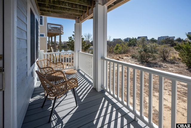 balcony featuring a water view