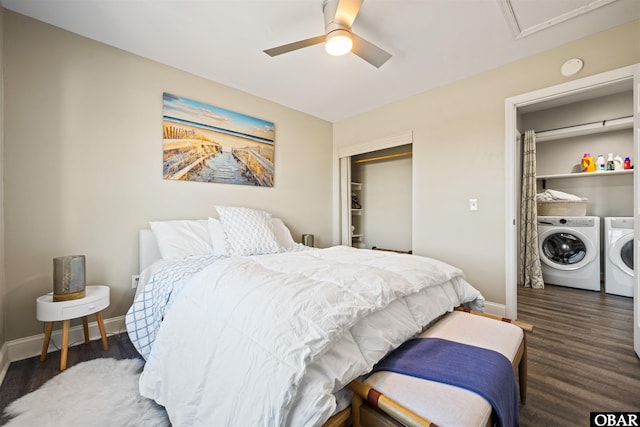 bedroom featuring baseboards, a ceiling fan, dark wood-style flooring, washing machine and dryer, and a closet