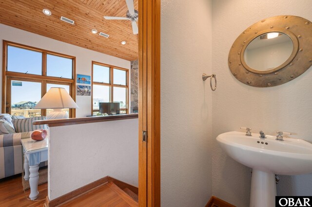 bathroom with visible vents, wood finished floors, recessed lighting, wooden ceiling, and ceiling fan